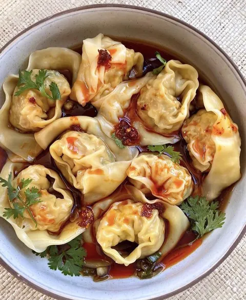 Pork Dumplings with Chilli and Sesame seed oil sauce