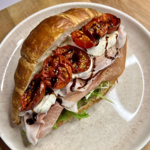 [homemade] Parma, Fresh Mozz, Roasted Tomatoes and Balsamic Glaze on Croissant