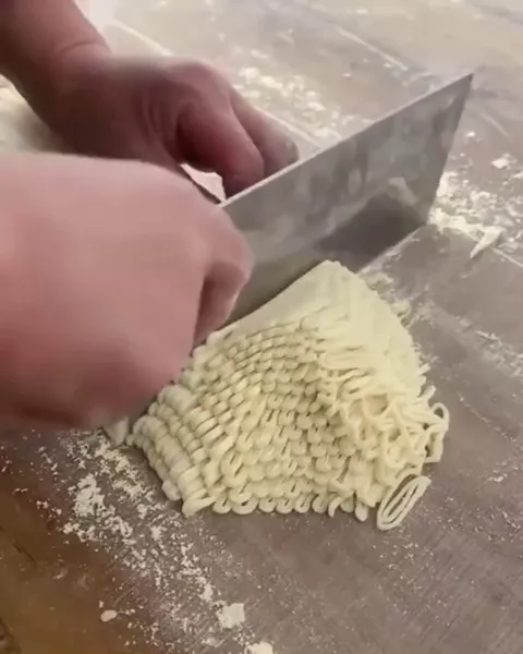 Soba noodles being cut