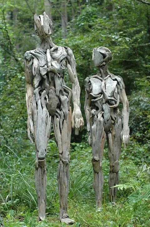 Eerie humanoid sculptures made out of driftwood by Japanese artist Nagato Iwasaki.