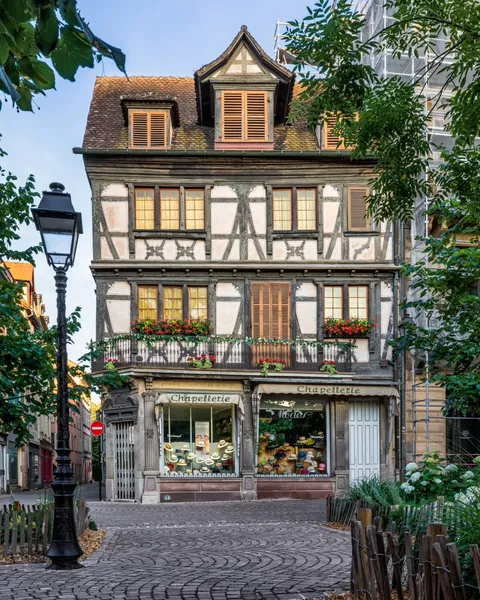 Old half-timbered building housing a hat store in Colmar, Alsace, northeastern France.