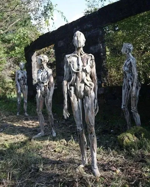 Eerie humanoid sculptures made out of driftwood by Japanese artist Nagato Iwasaki.