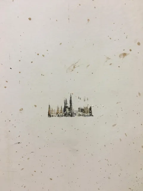 Something bumped against a wall at work and made a painting of a snowy town.
