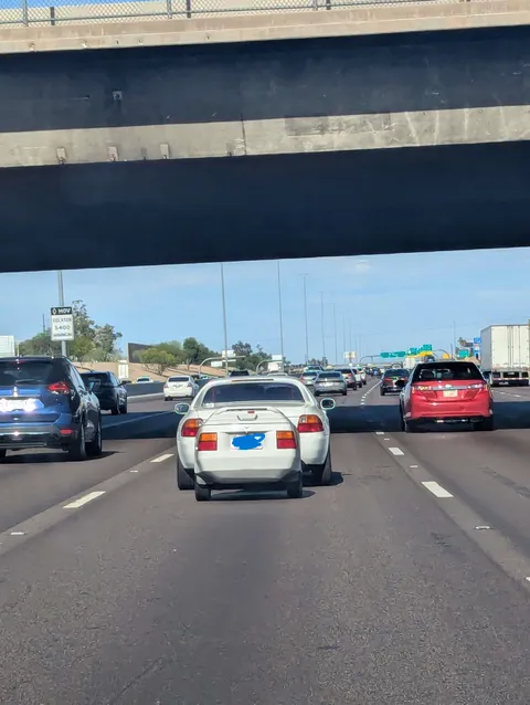 Honda Del Sol with a trailer that also looks like the back of a Del Sol
