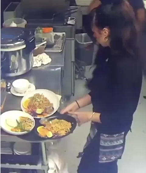 Waitress dropping food