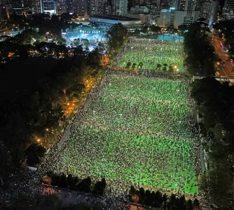 Thousands of Hong Kongers defy police ban to attend annual Tiananmen candlelight vigil