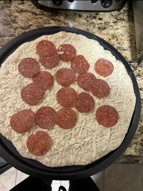 After a long day of work, I went to make a frozen pizza. It came out of the box with no sauce….