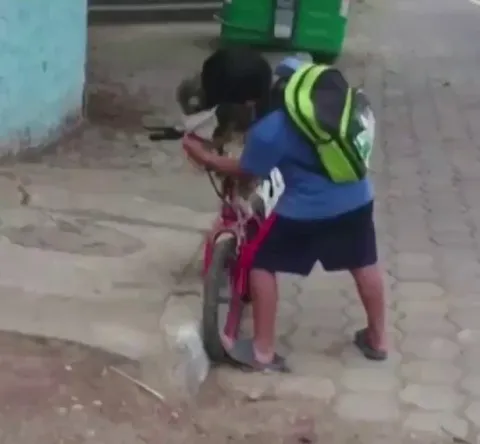 This young man was seen recently in Ecuador putting a face mask on his dog before putting one on himself
