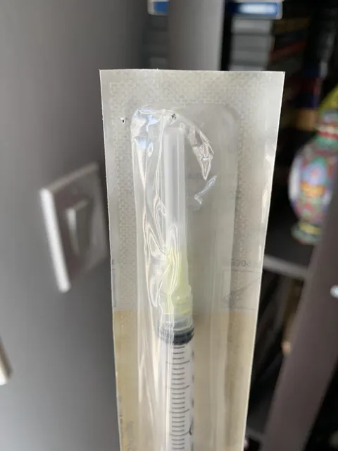 Pharmacy stapled receipt through my syringe’s plastic wrapping, so now it’s not sterile