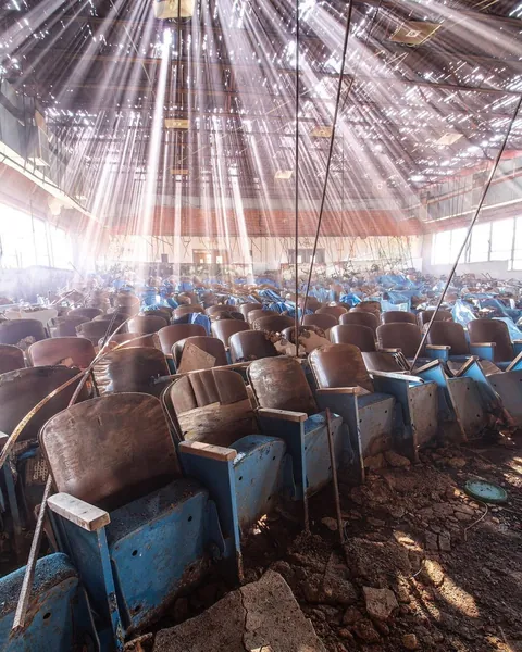 Light rays making their way into an abandoned theater.
