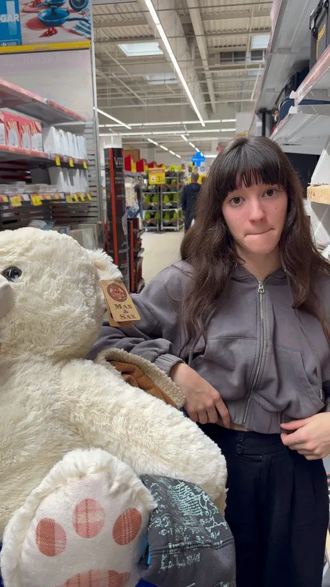 Exploring the aisles with my giant stuffed friend 
