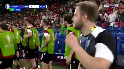 The Georgian team celebrating their victory against Portugal and advancing to the knockouts for the first time in history, in their first ever Euros