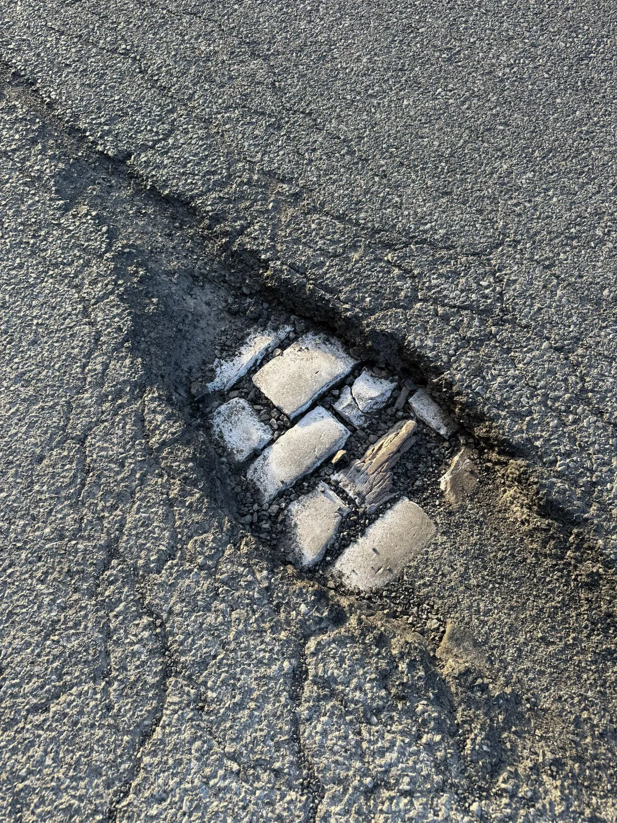A pothole so deep the next layer of history has been uncovered.