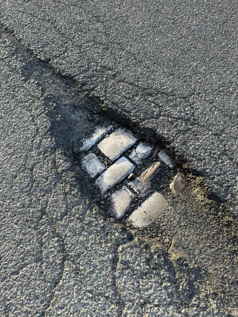 A pothole so deep the next layer of history has been uncovered.