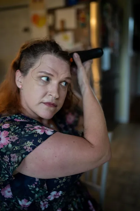 Shaving my head after week one of chemo