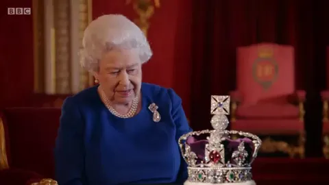 BBC documentary maker asks if the coronation crown can be moved a little closer to the Queen - guy moves it half an inch...