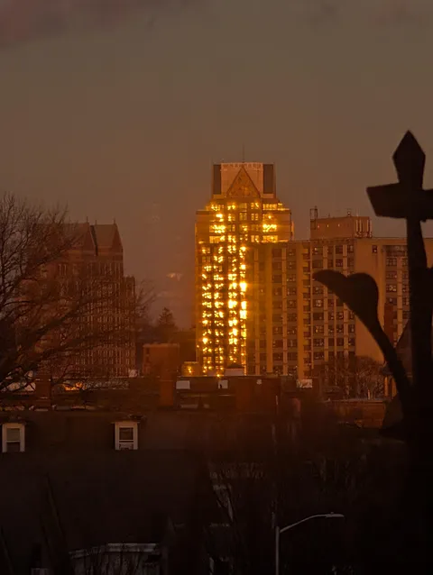 Sunset reflecting on building looks like it's burning internally