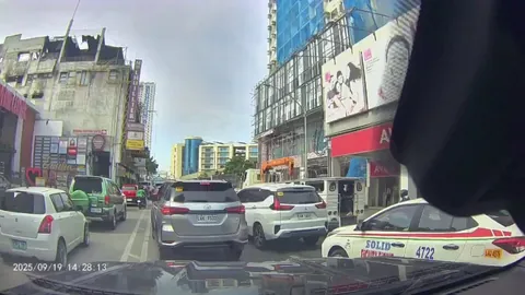 Debris falling hits a dump truck from 28-story building.