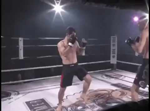Fighter helps opponent relocate shoulder. Real sportsmanship.