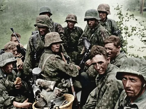 [Colorized]  Members of the SS Division Totenkopf during the Battle of Kursk. (1943)