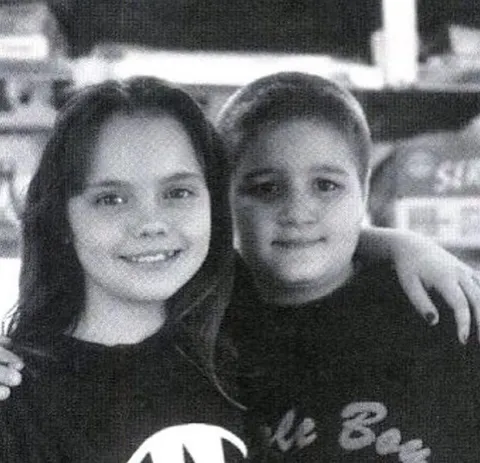 Christina Ricci and Jimmy Workman behind the scenes of The Addams Family, 1991.
