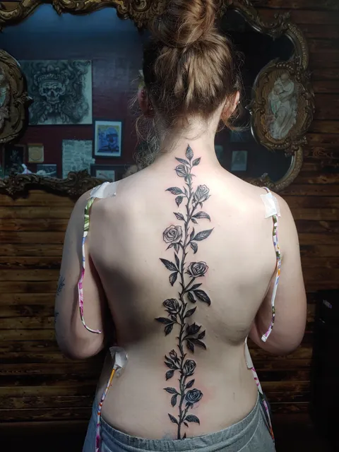 Rose and thorns spine tattoo done by Nini out of La Raza in Tulare, California