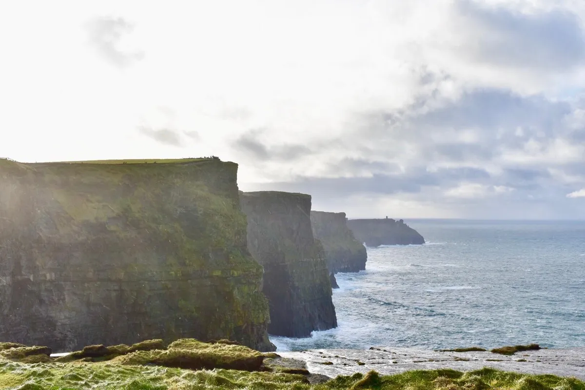 Got this shot of the sun making an appearance in Ireland at the Cliffs of Moher!