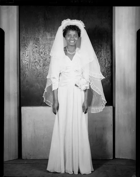Young couple at their wedding (a war wedding) circa 1940s.