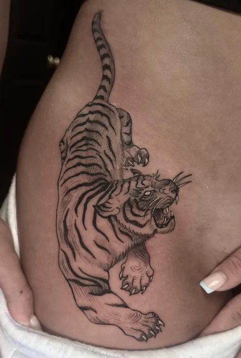 Fine-line tiger by Brandon Santangelo at Black Book Tattoo in Long Island NY 