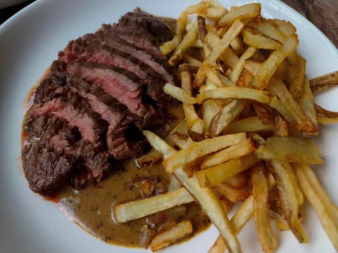 [homemade] hanger steak, peppercorn sauce, hand cut fries