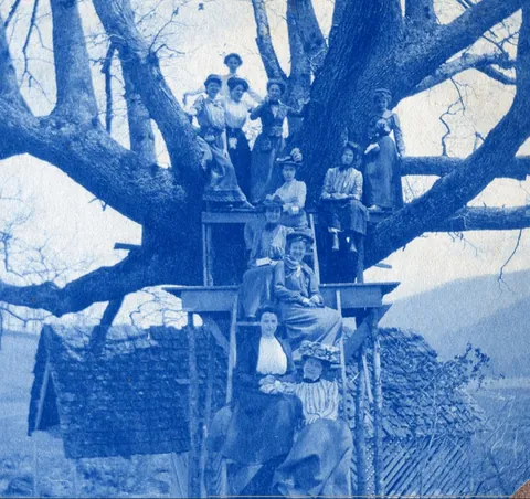 An unnamed young woman recorded her senior year at Asheville Female College in a photo album, Asheville, North Carolina, 1902. It includes a dorm room, group shots of friends, playing in snow, a visit to the mountains, their final midnight party before graduation, and graduation day itself.
