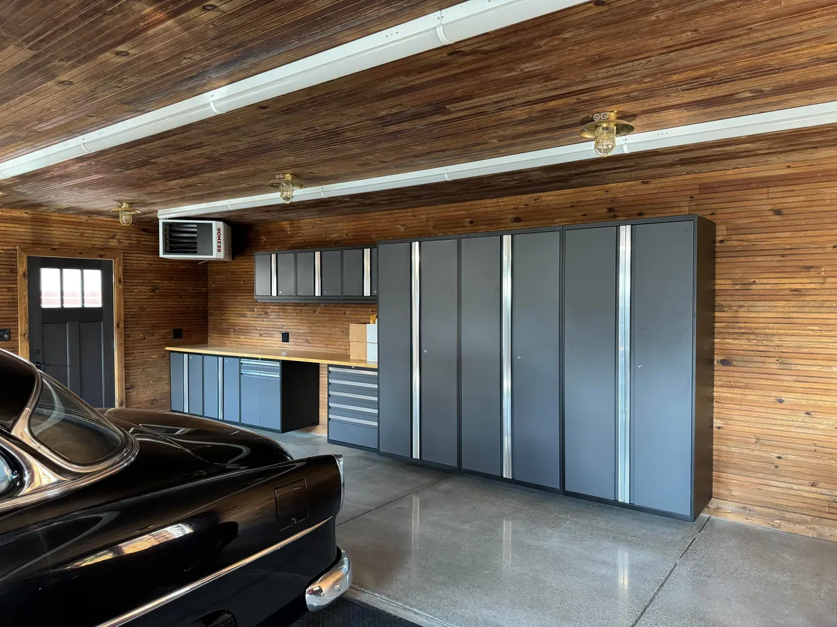 Just had the time to Spring Clean and since we finally finished the concrete floors and got cabinetry installed, I wanted to share! Here is our new, 1920s-styled garage in Detroit with a custom attic elevator, our architectural drawings and images of the original 1927 garage we replaced.