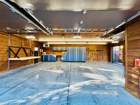 Just had the time to Spring Clean and since we finally finished the concrete floors and got cabinetry installed, I wanted to share! Here is our new, 1920s-styled garage in Detroit with a custom attic elevator, our architectural drawings and images of the original 1927 garage we replaced.