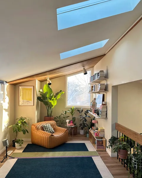 Reading nook under a slanted ceiling with skylights in an Ontario home, Canada [1440x1800]