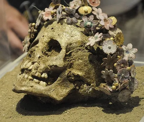 Girl buried with a crown of ceramic flowers. Patras, c. 300-400 B.C. Can be seen at the Museum of Patras, Greece.