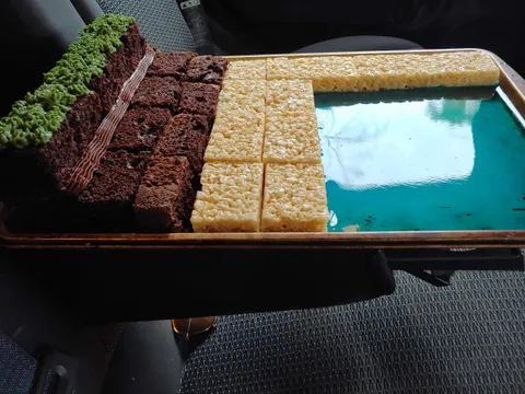 My mom made a cool Minecraft cake for my little cousin along with another cake that has a creeper face on it with frosting