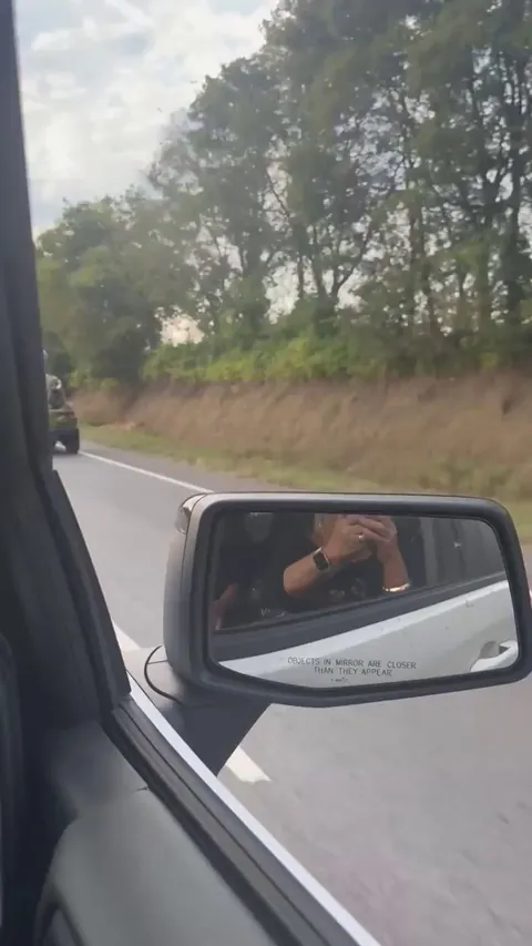 A woman puts a giant skeleton in her Jeep