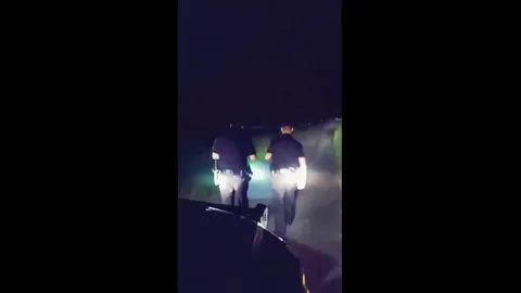 Police responding to a call in a cemetery