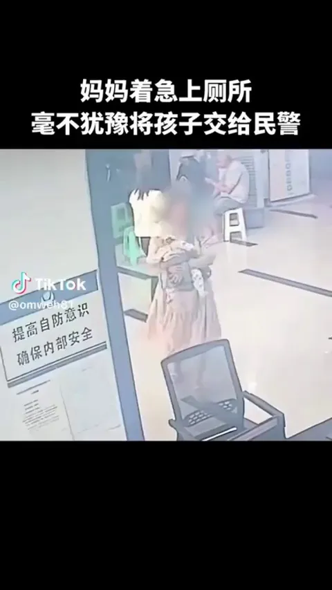 This cop's reaction when a woman handed him her baby so she could use the restroom