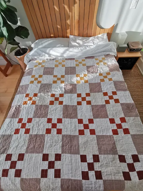 I taught myself to sew to make a cozy fall quilt for my bed. 90% thrifted fabric