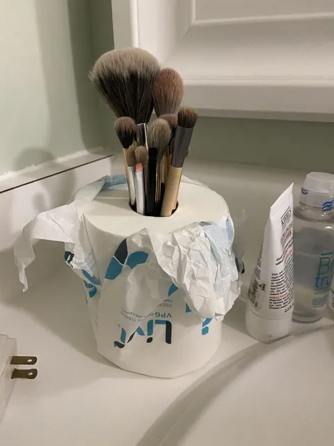 I hate laying my brushes flat on the hotel sink. Just realized this works! 