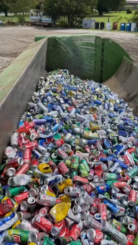 Soda cans being crushed