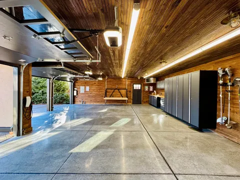 Just had the time to Spring Clean and since we finally finished the concrete floors and got cabinetry installed, I wanted to share! Here is our new, 1920s-styled garage in Detroit with a custom attic elevator, our architectural drawings and images of the original 1927 garage we replaced.