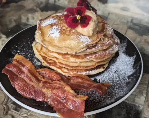Pancakes and bacon with a coffee butter 
