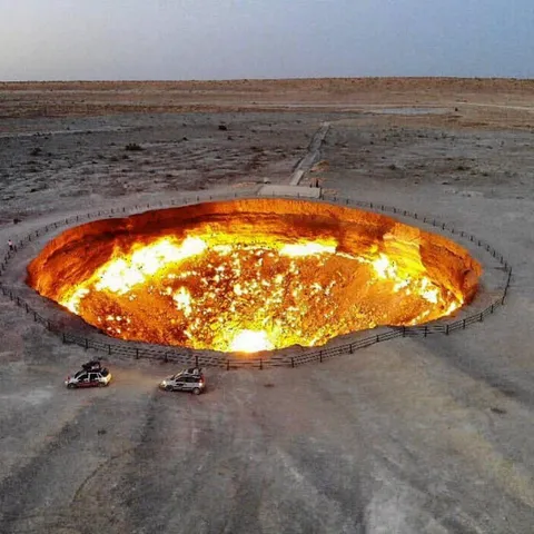 Deep in Turkmenistan’s Karakum Desert, there’s a place called the Darvaza Gas Crater, often referred to as the “Door to Hell.” This massive pit has been on fire for over 50 years. Its origin is equally as dramatic as its appearance