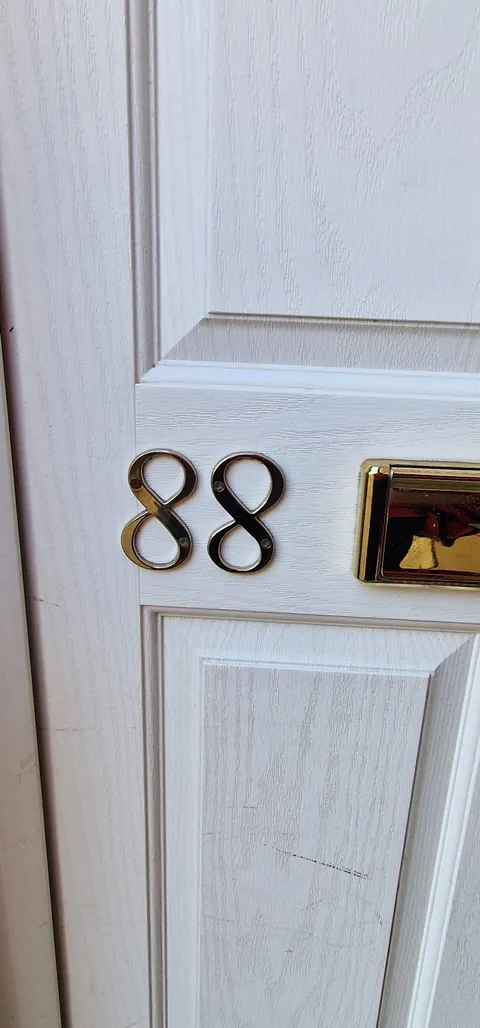 One of the 8's on this door number which I frequently deliver to is upside down.