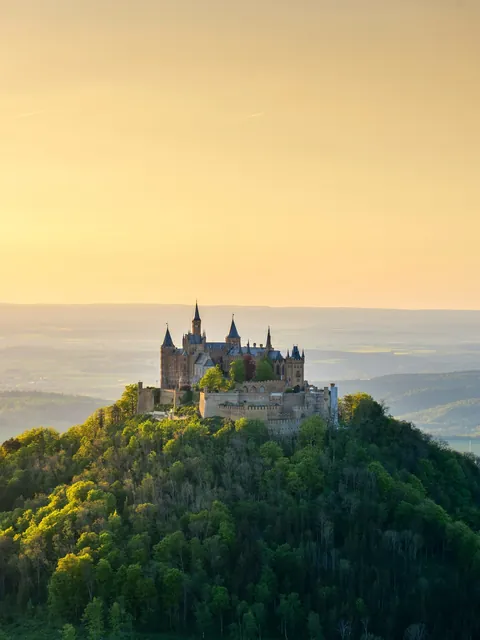 Hohenzollern Castle atop the lush Mount Hohenzollern, Baden-Württemberg, Germany.