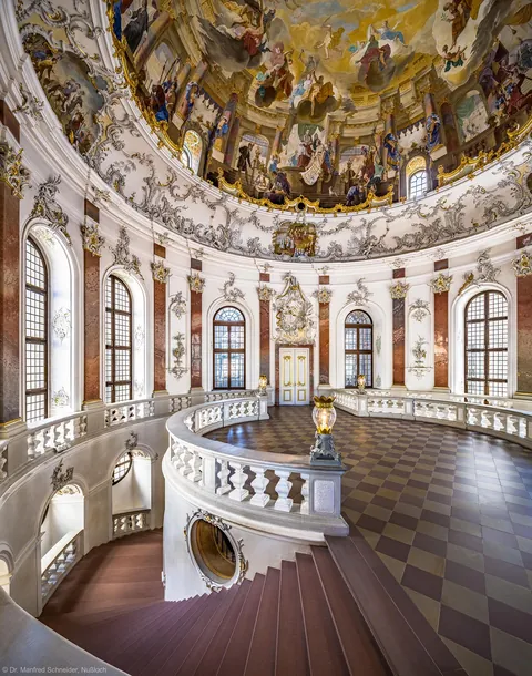 The domed and circular staircase of Bruchsaal Palace, Germany.