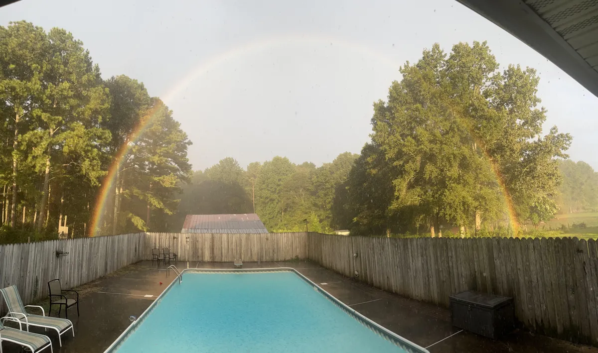Both ends of the rainbow in our backyard