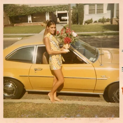 Girl posing with a Ford Pinto, 1971